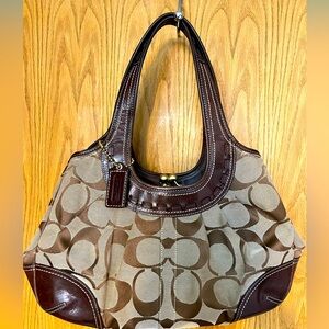 Brown Coach Shoulder Bag with change pouch style.